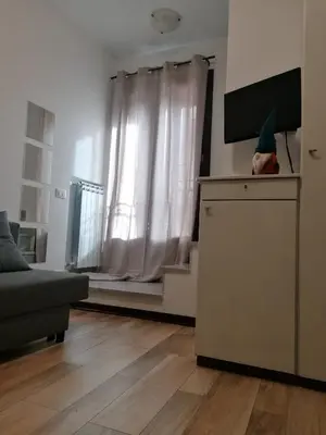 a living room with a couch and a television at A casa della Vero in Palermo