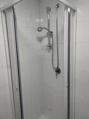a shower with a glass door in a bathroom at Corso Butera 489 in Bagheria