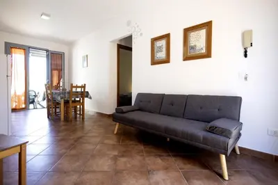 a living room with a couch and a table at Appartamenti da Lulù in San Vito lo Capo