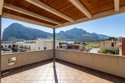 a view from a balcony with mountains in the background at Appartamenti da Lulù in San Vito lo Capo