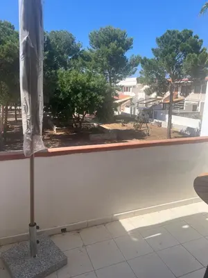 a closed umbrella sitting on top of a window at cielo blu in San Vito lo Capo