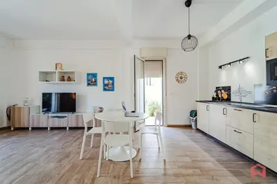 a kitchen and dining room with a table and chairs at Charming Holiday Home in Palermo in Palermo