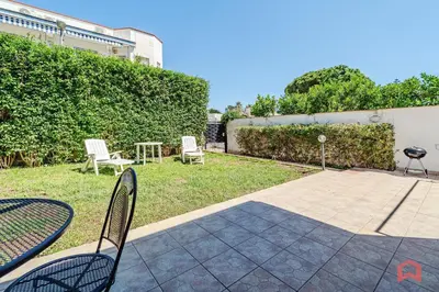 a patio with two chairs and a table and chairs at Charming Holiday Home in Palermo in Palermo