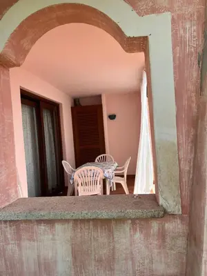 a patio with a table and chairs on a balcony at Residenza Uliveto in Monreale