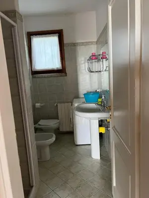 a small bathroom with a sink and a toilet at Residenza Uliveto in Monreale