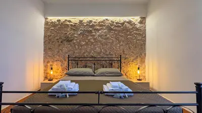a bedroom with a bed with towels on it at Appartamento Cinisi in Cinisi
