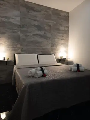 a bedroom with a bed with two towels on it at La Stanza del Viaggiatore in Palermo