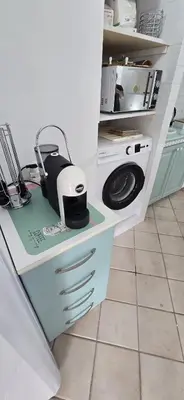 a kitchen counter with a toaster on top of it at Lulu' Home - Guidaloca - Scopello in Scopello