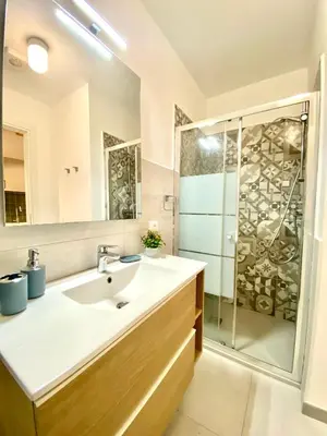 a bathroom with a sink and a shower at Loft Pergola, posizione strategica in Castellammare del Golfo