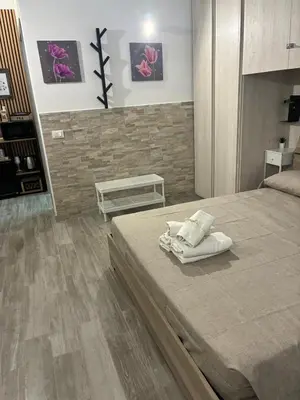 a bedroom with a large bed with white towels on it at Mamma Chica Alloggio Turistico a Palermo in Palermo