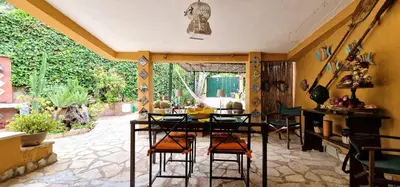 a dining room with a table and some chairs at Villa Dream House Scopello in Scopello