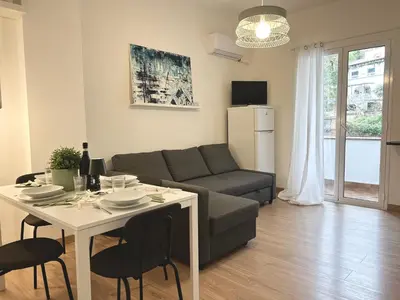 a living room with a couch and a table at Charlotte in Palermo