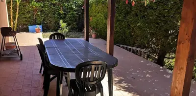 a blue table and chairs on a patio at Casa a Campofelice di Roccella in Campofelice di Roccella