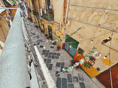 an overhead view of a narrow street with buildings at Oxalis Rooms & Suite in Palermo