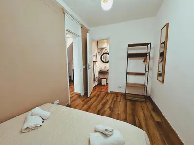 a bedroom with a bed with two towels on it at Oxalis Rooms & Suite in Palermo