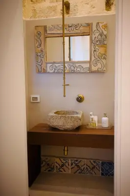 a shower in a bathroom with a shower curtain at Serafina Suites in Palermo