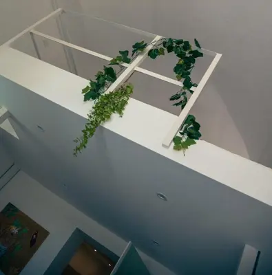 a white staircase with a green plant on it at Art suite palermo in Palermo