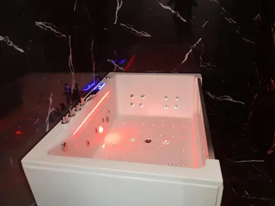 a white bath tub with lights in it at Suite Nobile in Palermo