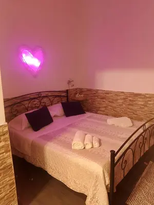 a bedroom with a bed with two towels on it at La casetta di Barbara in Palermo