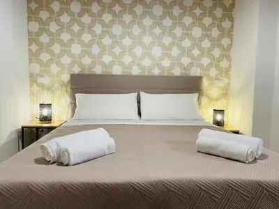 a bed with two white pillows on top of it at Casa di Anna in Palermo