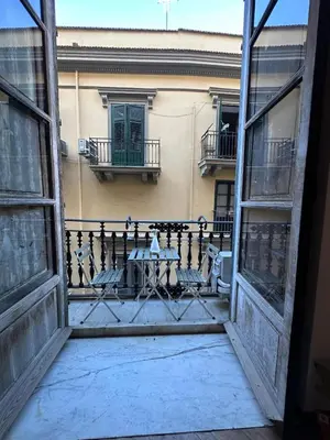 a view from an open window of a balcony at La finestra sugli archi in Palermo