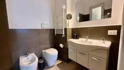 a room with a bed and a mirror at Castellammare Residence in Palermo