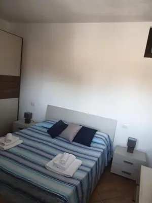a bedroom with a bed with two towels on it at CASA di VIA PITRE' 29 in Palermo