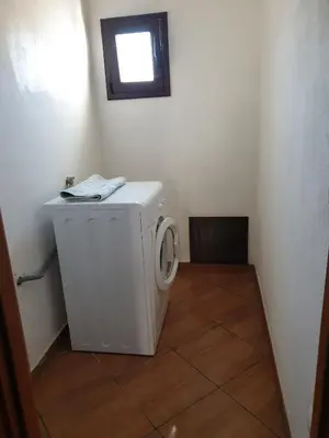 a washing machine in a room with a window at CASA di VIA PITRE' 29 in Palermo