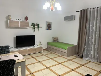 a living room with a table and a couch at Ocean's Holiday House in Terrasini