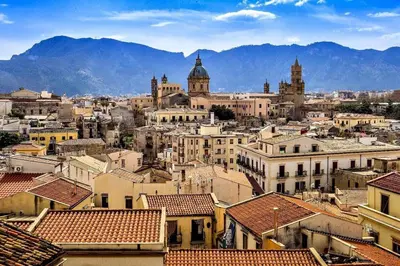 an apartment building with balconies and plants on it at Attico Finocchiaro - Terrazza in Centro Wifi Free in Palermo