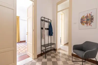 a white bedroom with a bed and a window at Casa Markea by Wonderful Italy in Palermo