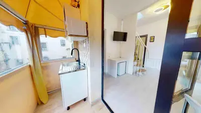 a small room with a kitchen and a living room at Teatro Massimo Terrace relax suite in Palermo