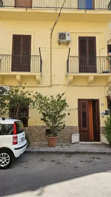a building with a tower in the background at Casa Porta Nuova 1989 in Palermo