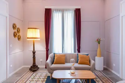 a living room with a couch and a table at Giardino Segreto - Affitta Camere in Castellammare del Golfo