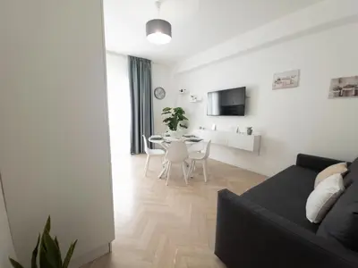a living room with a couch and a table at Light Charme, Natural Light Apartment a due passi dalla PIAZZA DUOMO in Terrasini