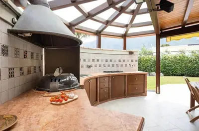 a kitchen with an outdoor kitchen with a stove at Luxury Hot tub Swimming pool Private pool Wi-Fi BBQ in Castellammare del Golfo