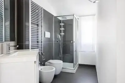 a bathroom with a shower and a toilet and a sink at Luxury Hot tub Swimming pool Private pool Wi-Fi BBQ in Castellammare del Golfo