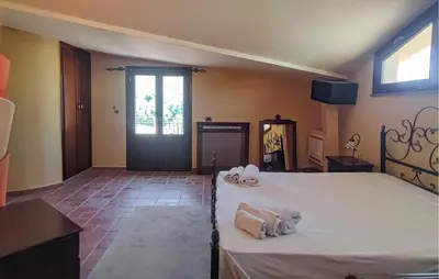 a bedroom with a bed with towels on it at Beautiful Home In Altavilla Milicia in Altavilla Milicia