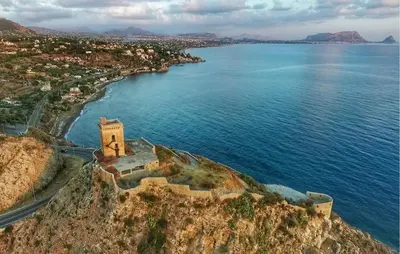 an old building on a cliff near the ocean at Beautiful Home In Altavilla Milicia in Altavilla Milicia