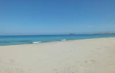 an empty beach with the ocean in the background at Awesome Apartment In Capaci With Wifi in Capaci