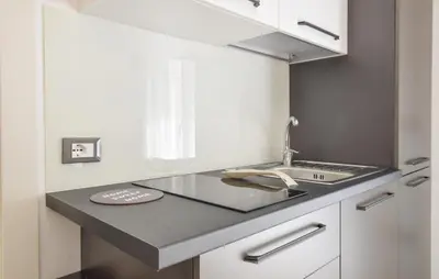a kitchen with a sink and a counter top at Awesome Apartment In Capaci With Wifi in Capaci