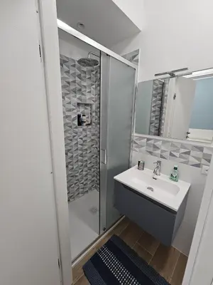 a bathroom with a sink and a shower at Palermo Francia in Palermo