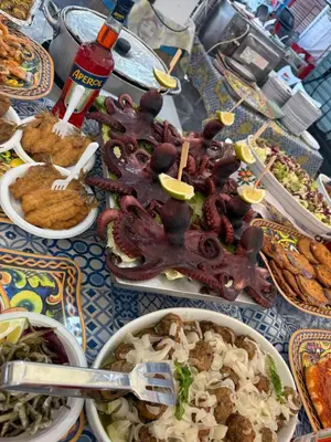 a table topped with dishes of food on a table at Dagma Spa Home Sicilia in Carini
