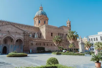 a large building with a tower on top of it at Cattedrale Suite in Palermo