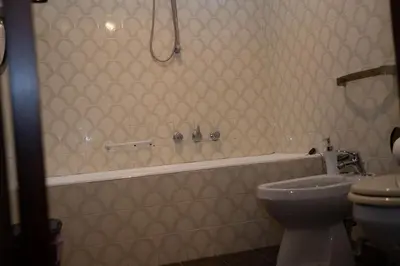 a bathroom with a sink and a mirror on the wall at Aurooms in Cinisi