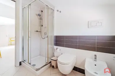 a bathroom with a shower and a toilet and a sink at Villa with private Pool in Castellammare dei Golfo in Castellammare del Golfo