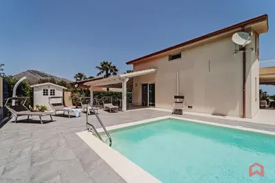 a swimming pool in the backyard of a house at Villa with private Pool in Castellammare dei Golfo in Castellammare del Golfo