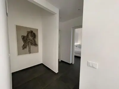 an empty room with a cross on the wall at Villa Tosto in Castelluzzo