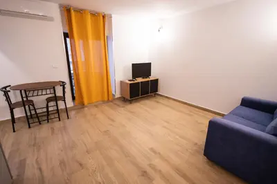 a living room with a couch and a table at Flat in center 2 in Palermo