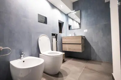 a bathroom with a white toilet and a sink at Flat in center 2 in Palermo